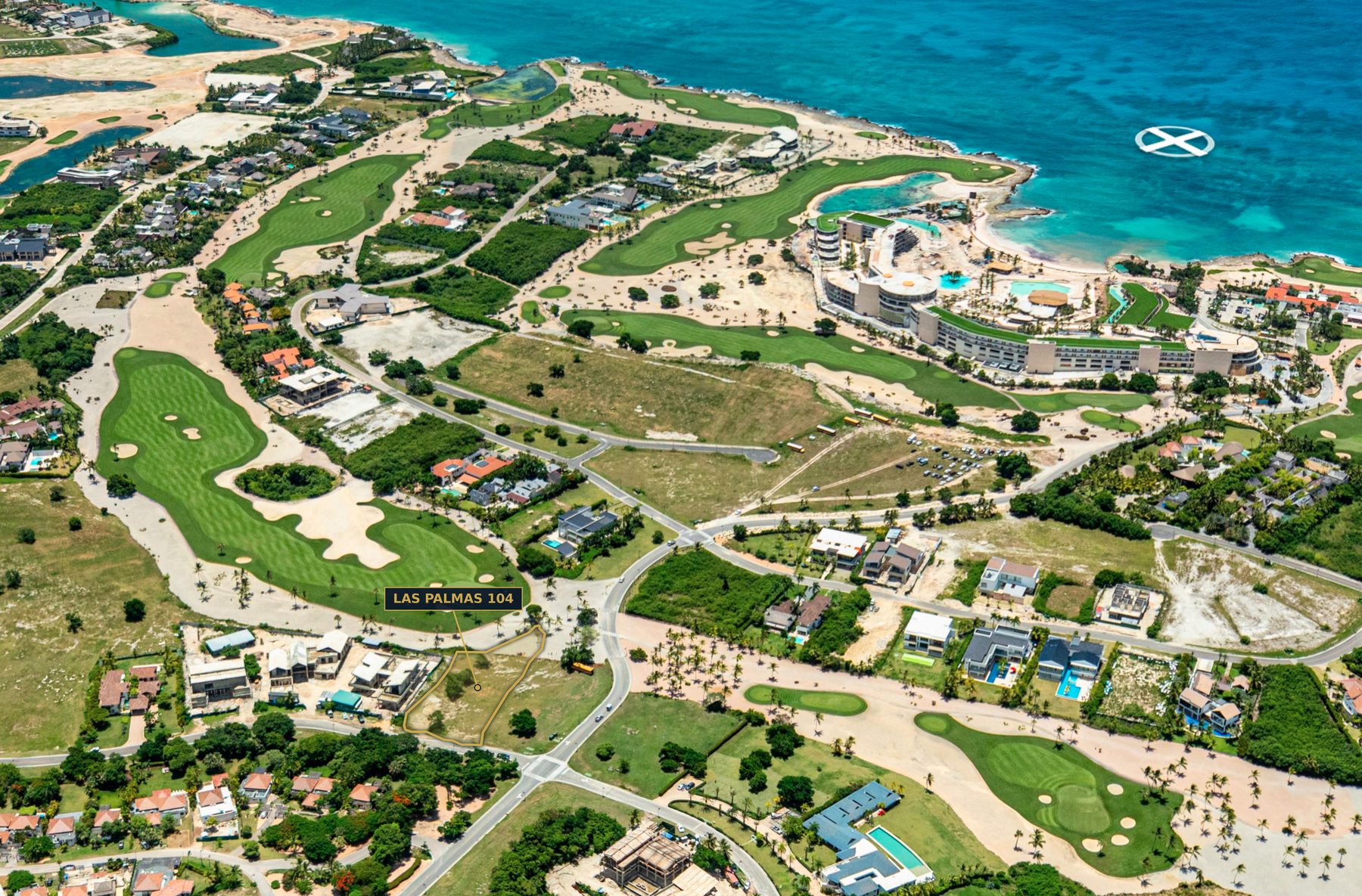 Aerial view of Cap Cana with the Las Palmas 104 parcel outlined on the Punta Espada golf course, coastline beyond